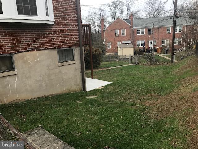 1001 Harwall Road Baltimore, MD 21207 - Photo 9 of 109 a front view of a house with a yard