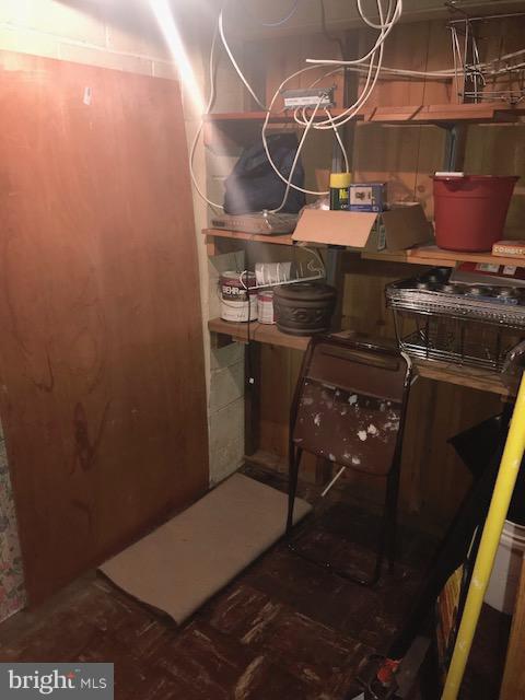 1001 Harwall Road Baltimore, MD 21207 - Photo 87 of 109 a room with water heater and wooden cabinets