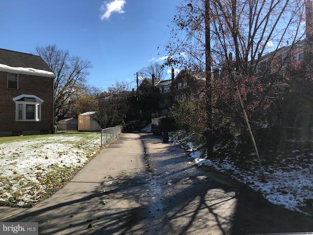 1001 Harwall Road Baltimore, MD 21207 - Photo 93 of 109 a view of a yard with an empty space and trees