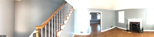 1001 Harwall Road Baltimore, MD 21207 - Photo 99 of 109 a view of a hallway with wooden floor and staircase