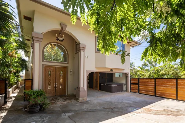 a view of entrance gate and trees