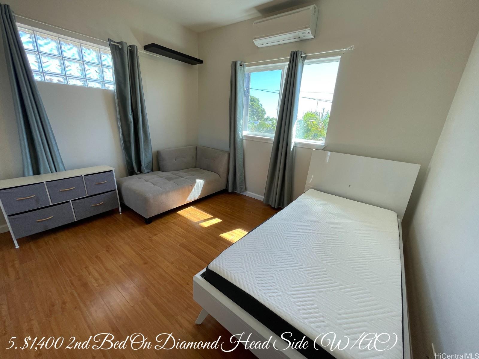 841 20th Avenue Honolulu, HI 96816 - Photo 15 of 17 a living room with furniture and a wooden floor