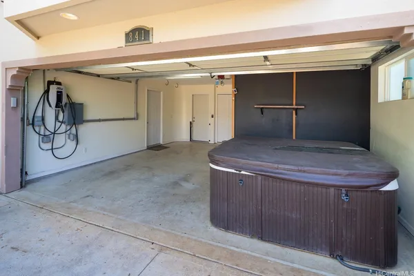 a kitchen with a refrigerator and cabinets