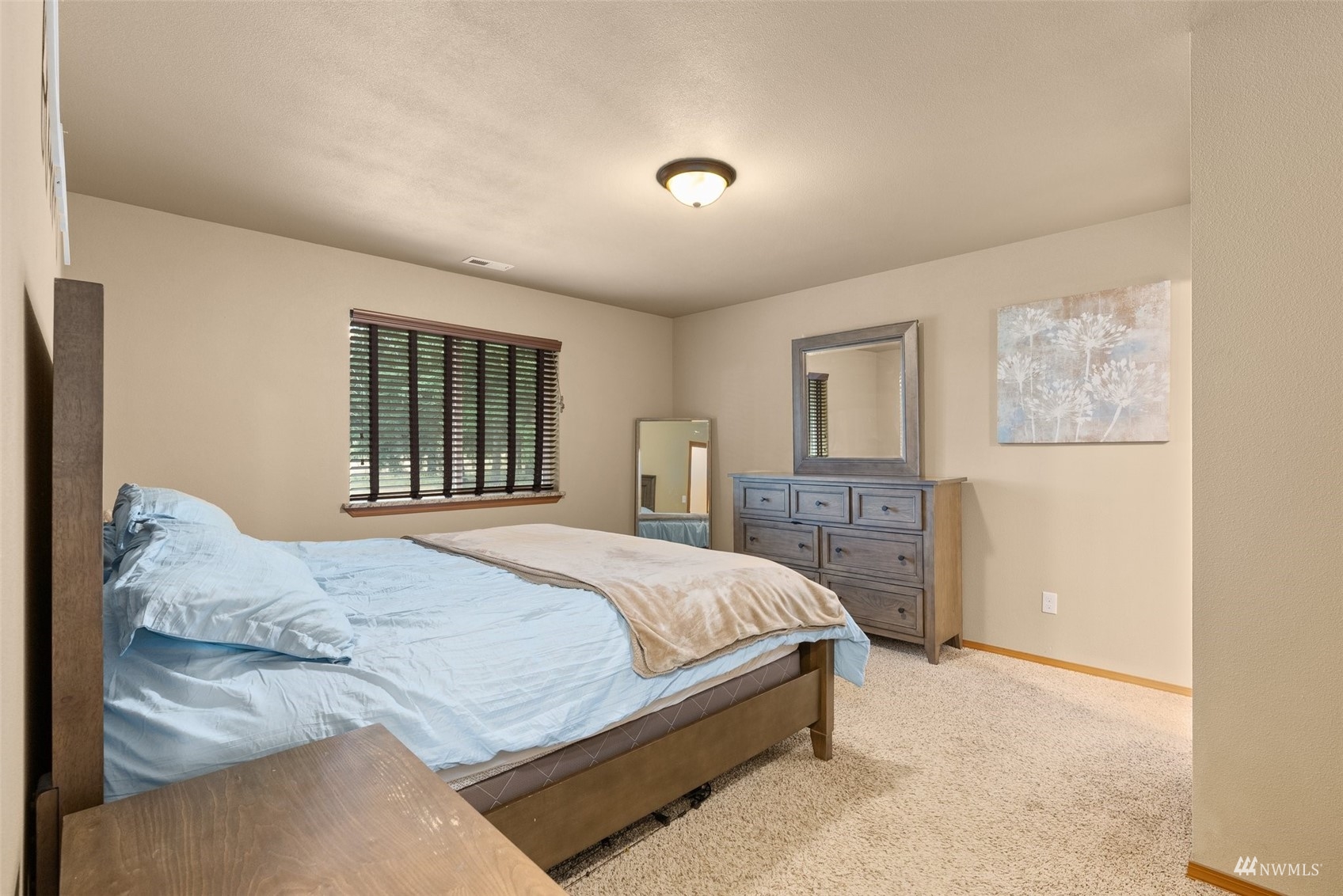 6320 192nd Lane Southwest Rochester, WA 98579 - Photo 16 of 30 a bedroom with a large bed and a window