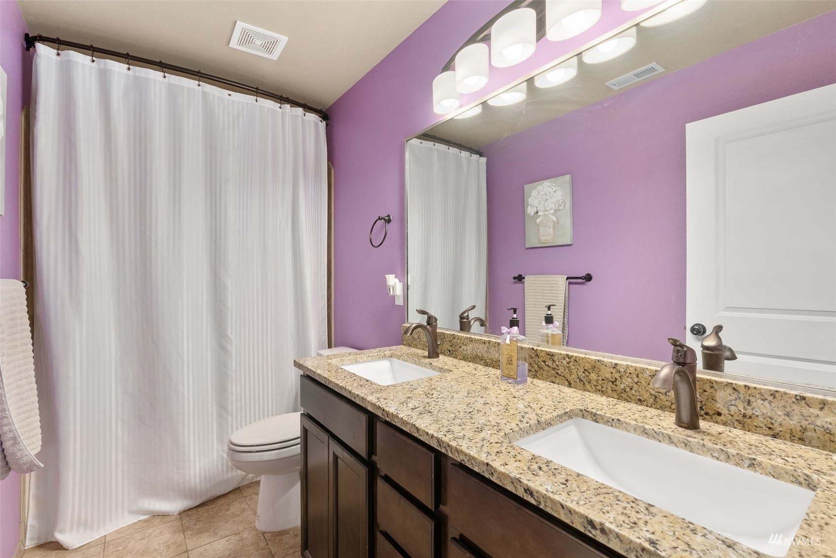 6320 192nd Lane Southwest Rochester, WA 98579 - Photo 18 of 30 a bathroom with a granite countertop sink and a mirror