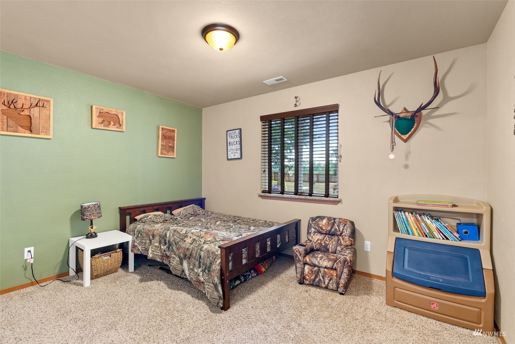 6320 192nd Lane Southwest Rochester, WA 98579 - Photo 19 of 30 a bedroom with a bed and a window