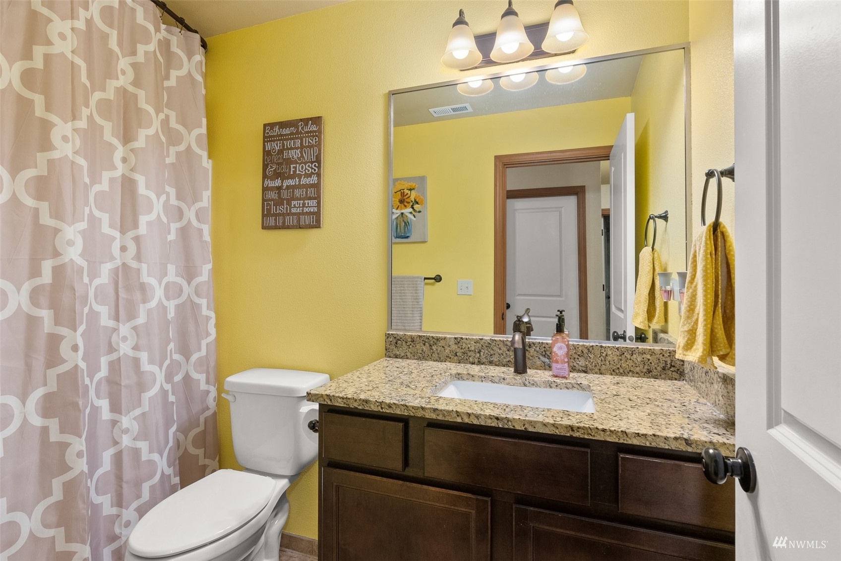 6320 192nd Lane Southwest Rochester, WA 98579 - Photo 22 of 30 a bathroom with a granite countertop toilet sink and mirror
