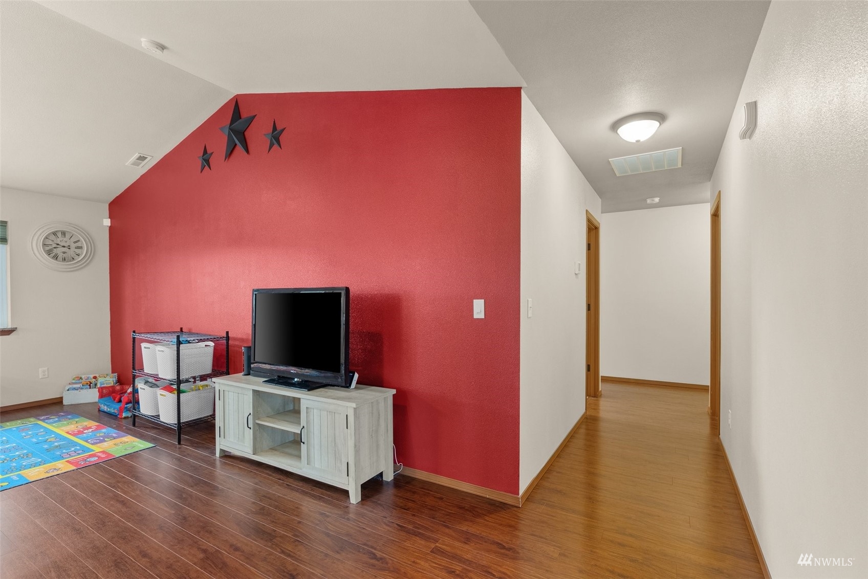 6320 192nd Lane Southwest Rochester, WA 98579 - Photo 23 of 30 a living room with furniture and a flat screen tv