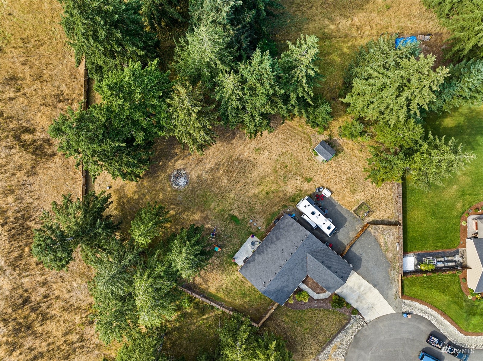 6320 192nd Lane Southwest Rochester, WA 98579 - Photo 3 of 30 an aerial view of a house with a yard and lake view