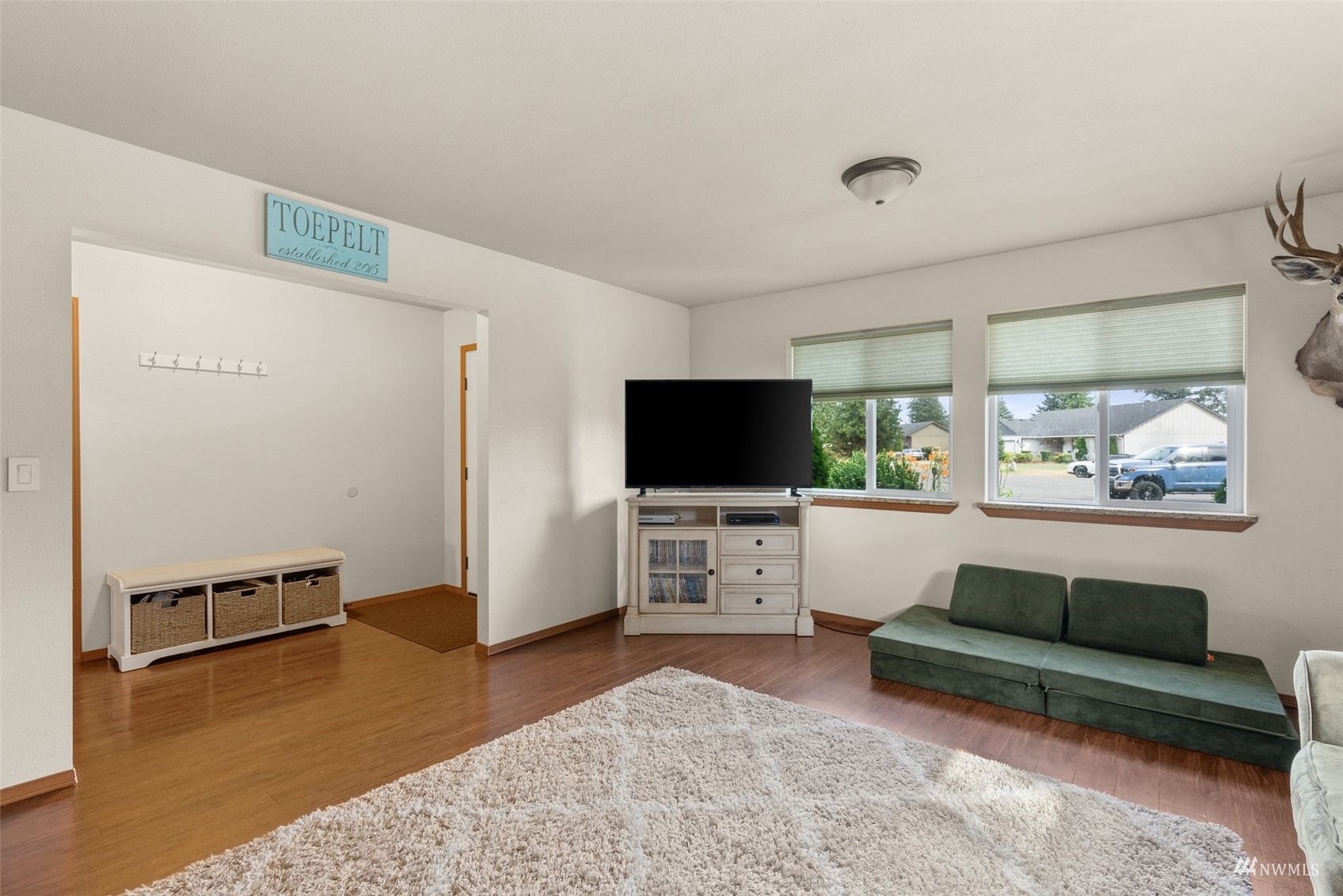 6320 192nd Lane Southwest Rochester, WA 98579 - Photo 10 of 30 a living room with furniture and a flat screen tv