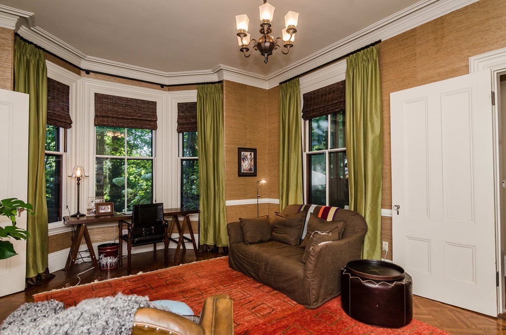 83 Elm Street Boston, MA 02130 - Photo 13 of 30 a living room with furniture potted plant and a window