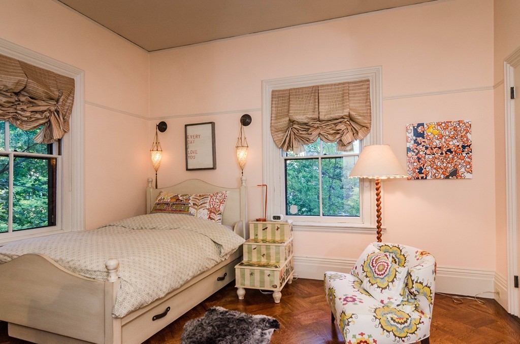 83 Elm Street Boston, MA 02130 - Photo 22 of 30 a bedroom with a bed and a window