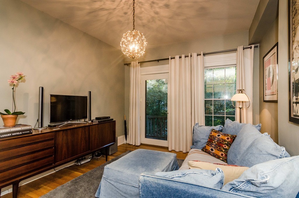 83 Elm Street Boston, MA 02130 - Photo 23 of 30 a living room with furniture and a flat screen tv