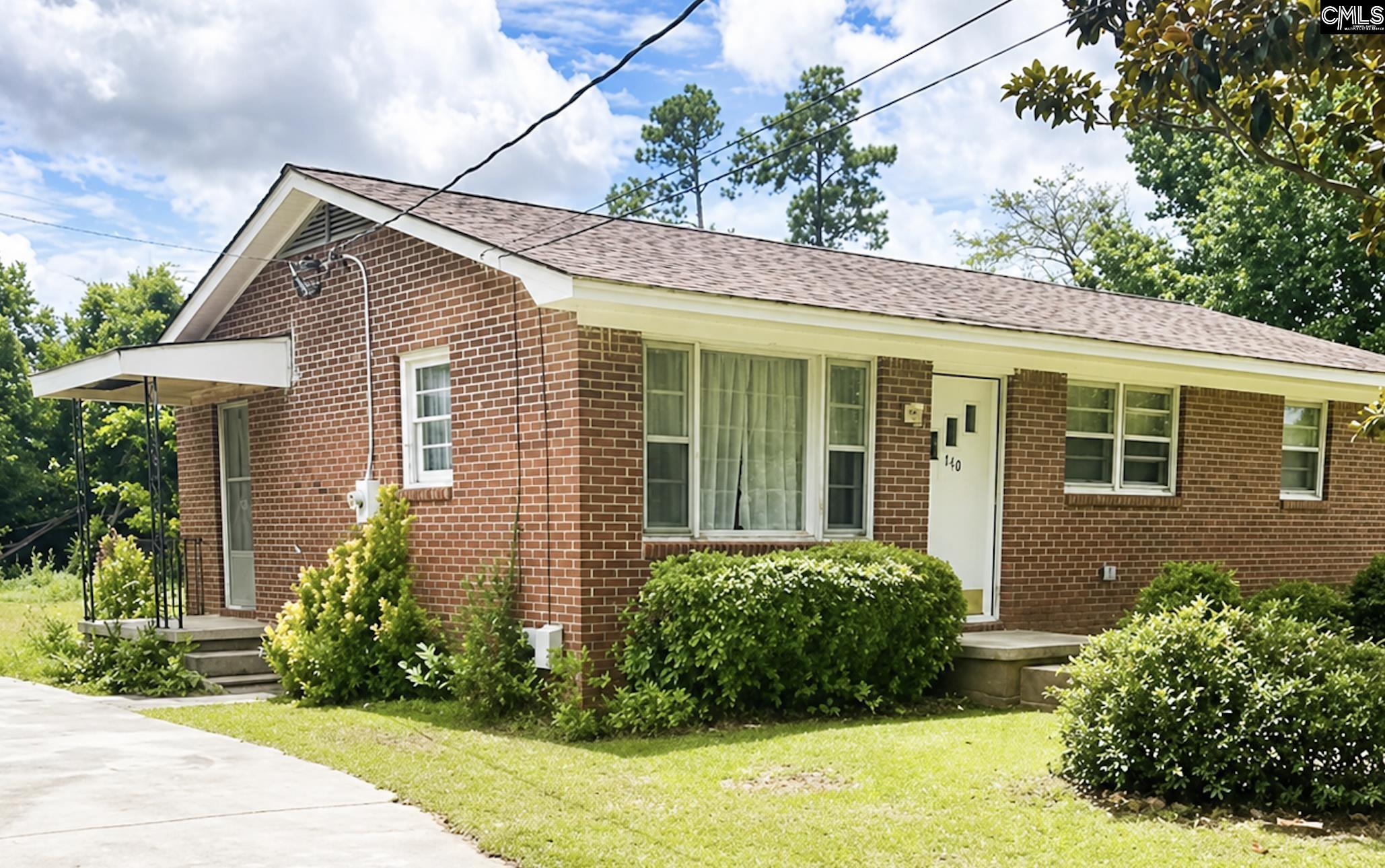 118 State Rd S-38-1224 Cordova, SC 29039 - Photo 2 of 12 a front view of a house with garden
