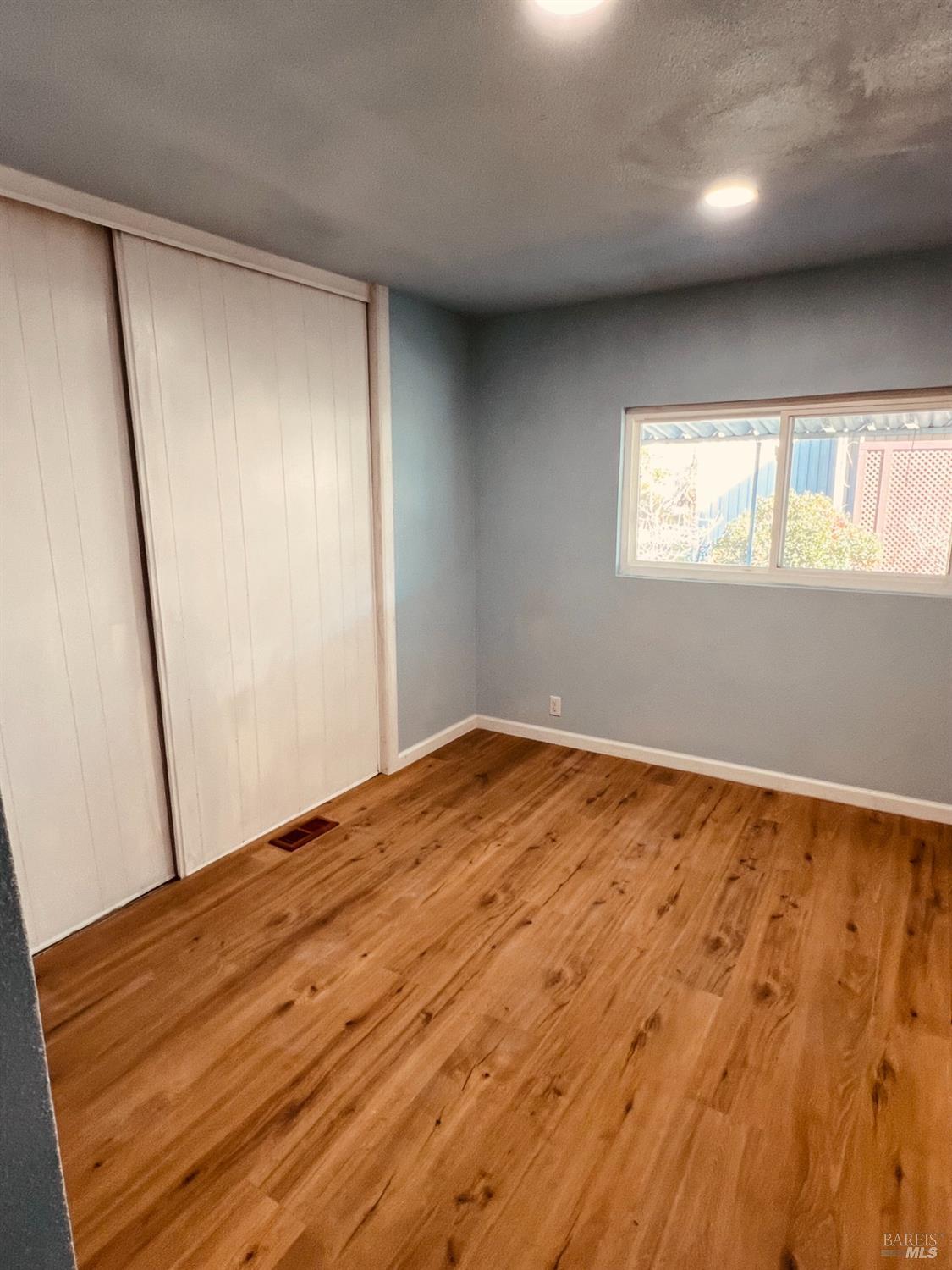 320 Chablis North Calistoga, CA 94515 - Photo 15 of 19 an empty room with wooden floor and windows