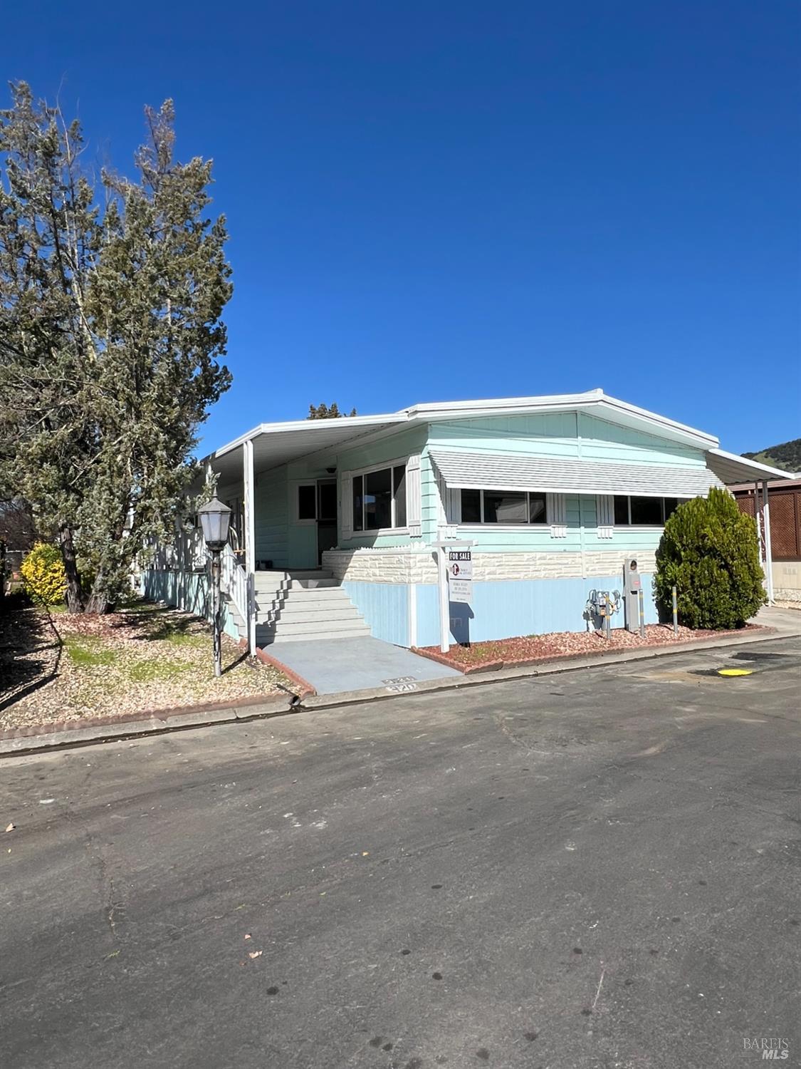 320 Chablis North Calistoga, CA 94515 - Photo 3 of 19 a front view of a house with a yard and garage