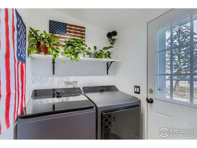 a kitchen with a stove a sink and a window