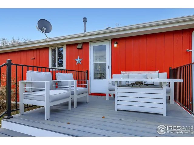 a view of living room with furniture and a window
