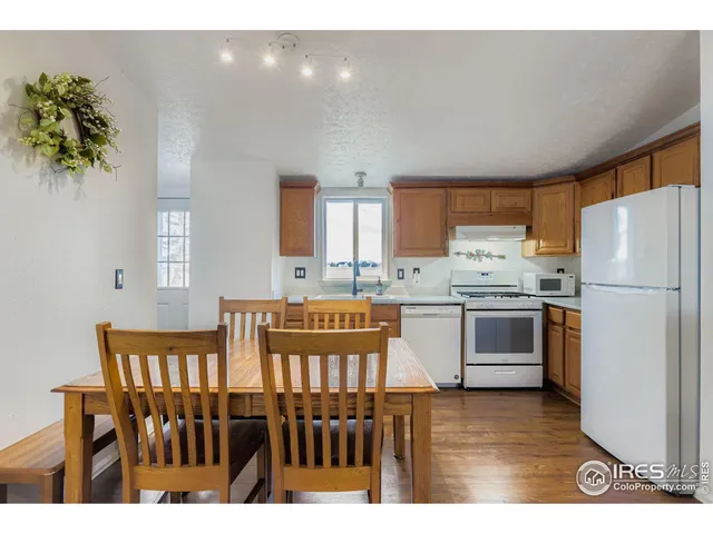 a kitchen with stainless steel appliances a refrigerator sink and cabinets