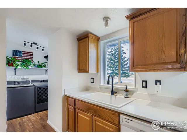 a kitchen with stainless steel appliances granite countertop a sink and cabinets