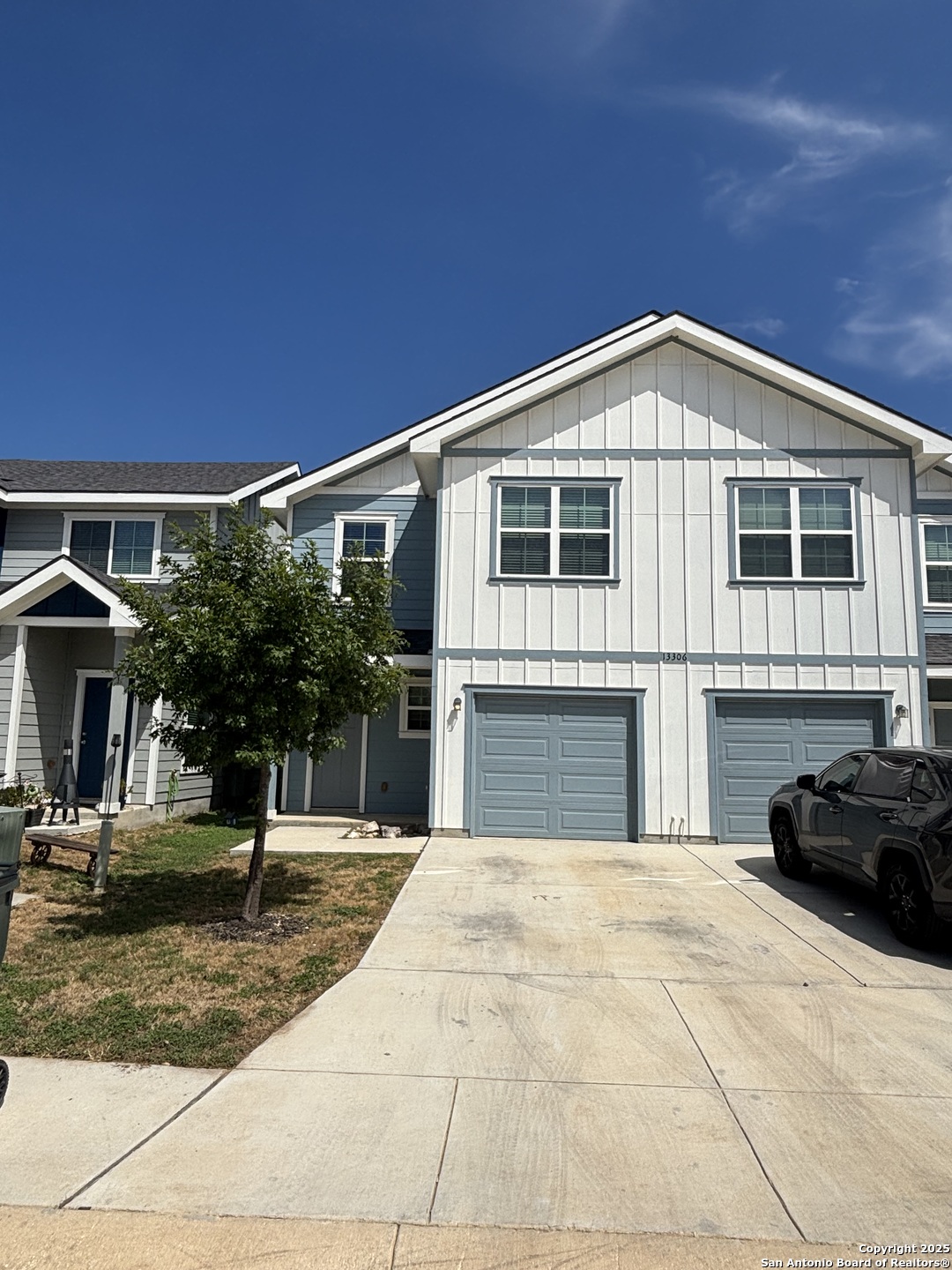 13311 Rowdy Cove, Unit 102 San Antonio, TX 78249 - Photo 1 of 19 a front view of a house with a yard