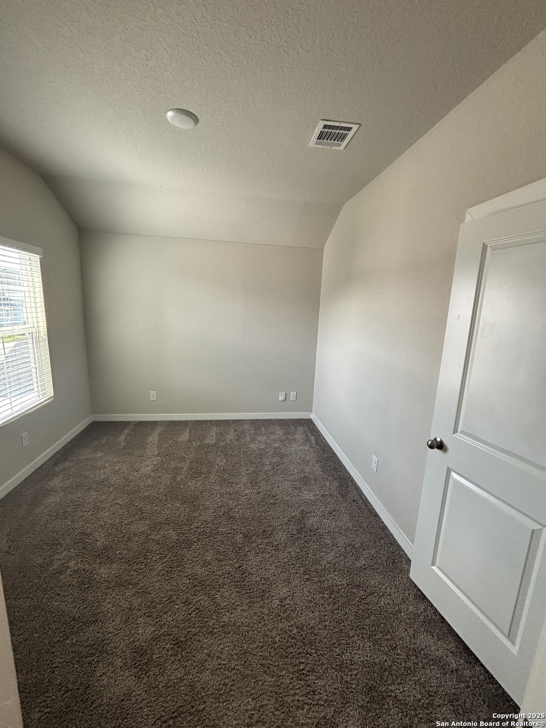 13311 Rowdy Cove, Unit 102 San Antonio, TX 78249 - Photo 17 of 19 an empty room with windows