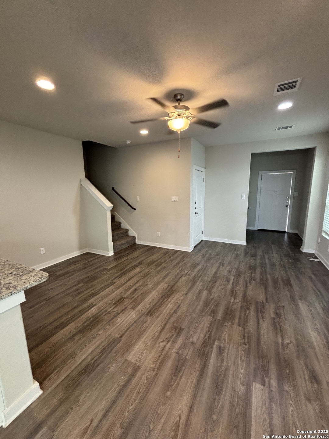 13311 Rowdy Cove, Unit 102 San Antonio, TX 78249 - Photo 9 of 19 a view of empty room with wooden floor