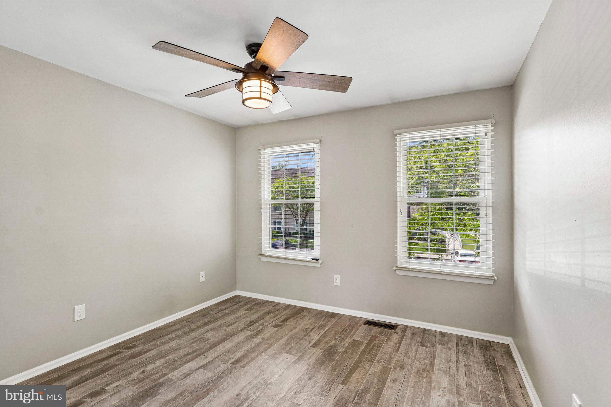 803 Wharton Road Mount Laurel, NJ 08054 - Photo 20 of 48 a view of an empty room with wooden floor and a window