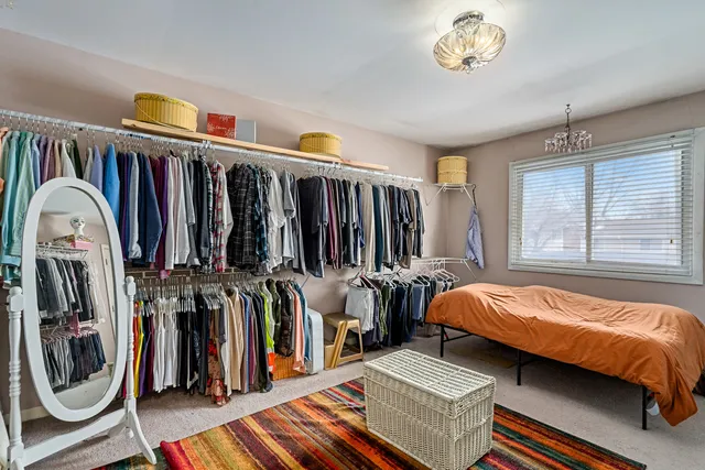 a bed room with a bed and a window