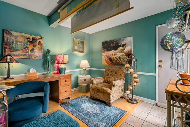 a living room with furniture and a rug