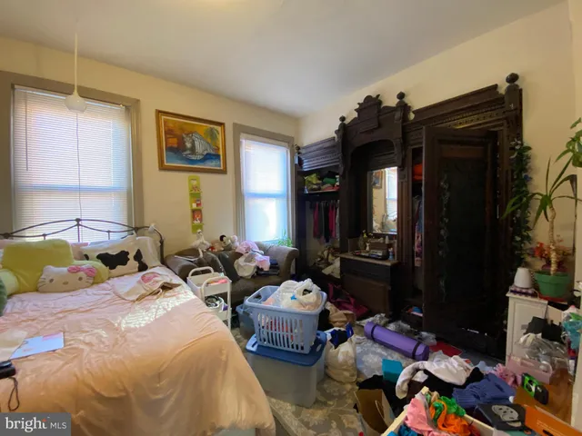 a bedroom with a bed and furniture