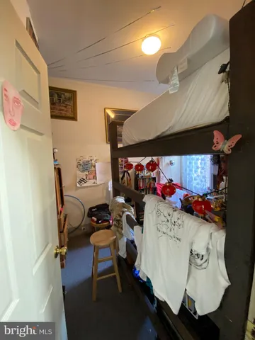 a bedroom with a bed furniture and a window