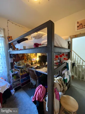 a room with gym equipment and a large window