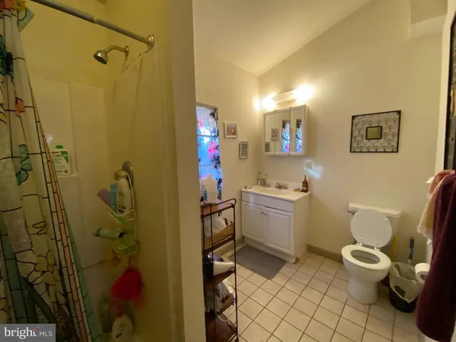 a bathroom with a toilet sink and shower