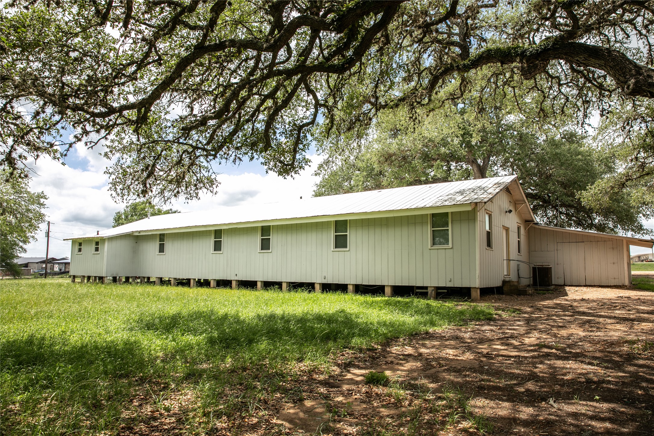 1503 Highway 237 Round Top, TX 78954 - Photo 24 of 25 a front view of a house with a garden