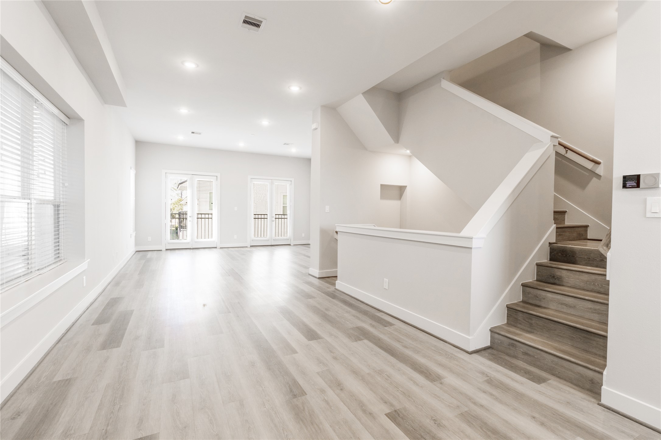 1250 North Post Oak Road, Unit C Houston, TX 77055 - Photo 9 of 31 Expansive open-concept living and dining area, perfect for entertaining.