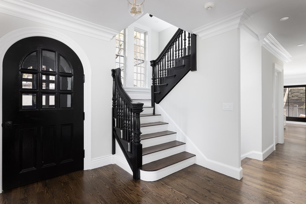 460 Walnut Street Brookline, MA 02445 - Photo 2 of 35 a view of entryway with wooden floor and stairs