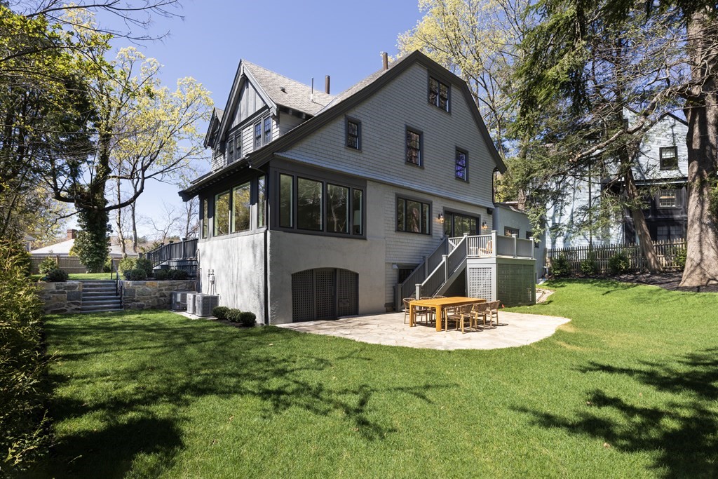 460 Walnut Street Brookline, MA 02445 - Photo 32 of 35 a front view of a house with a yard