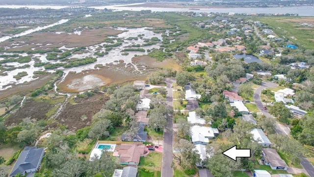 a view of a livingroom with furniture and chandelier fan