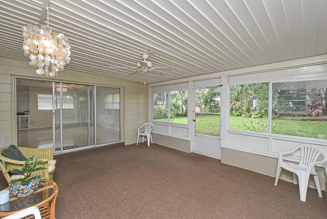a room with window and pool table