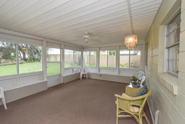 a bathroom with a granite countertop toilet sink and mirror