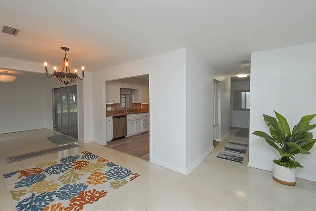 a kitchen with cabinets stainless steel appliances and a counter space