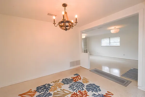 a view of a room with wooden floor
