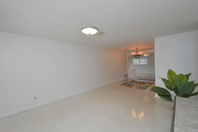 a front view of a house with outdoor seating