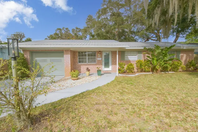 front view of a house with a garden