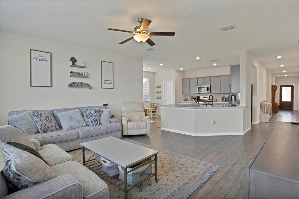 621 Ridgeback Trail Fort Worth, TX 76052 - Photo 8 of 22 Open-concept living space featuring wood-finish flooring, recessed lighting, and a ceiling fan