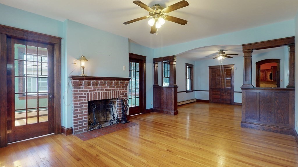 171 June Street Worcester, MA 01602 - Photo 1 of 35 a view of an empty room with wooden floor fireplace and a window