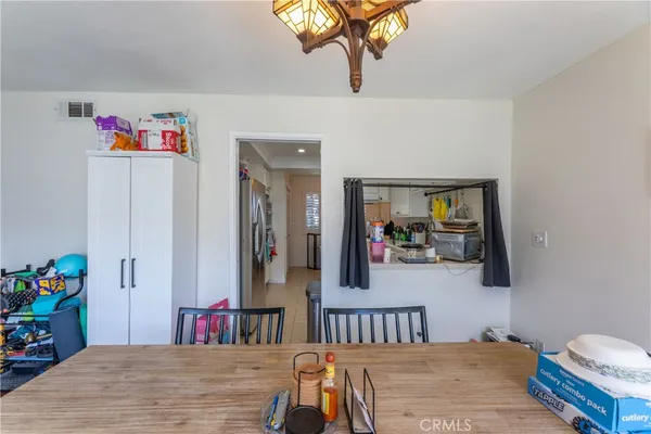 a kitchen that has a sink cabinets and stainless steel appliances