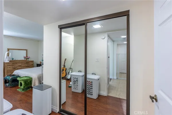 a view of walk in closet with clothes