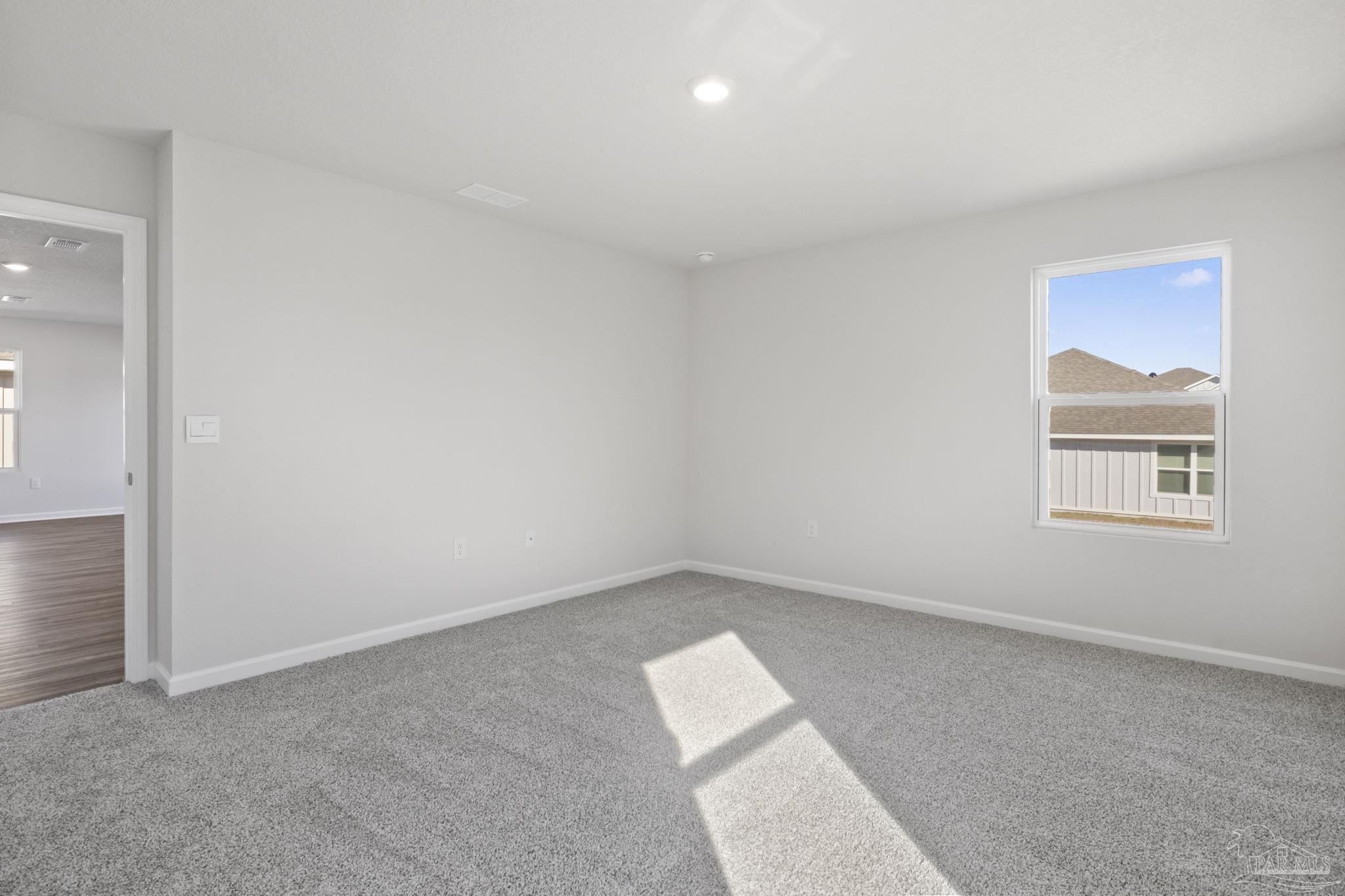 5072 Rainwater Road Milton, FL 32583 - Photo 11 of 18 an empty room with a window